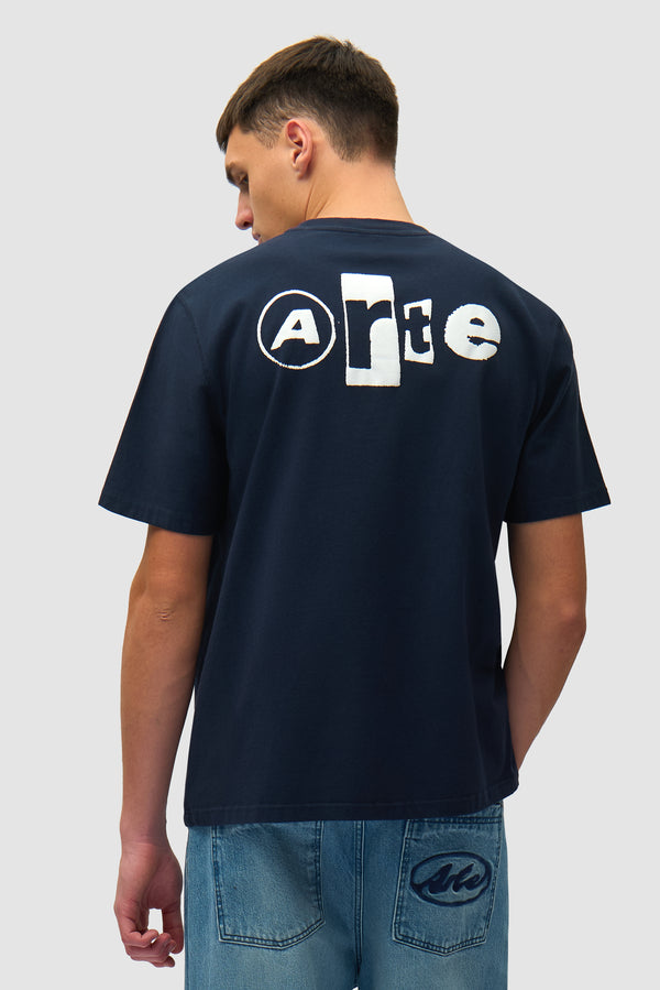 Back Collage T-shirt in Navy worn by a model, half-body back view