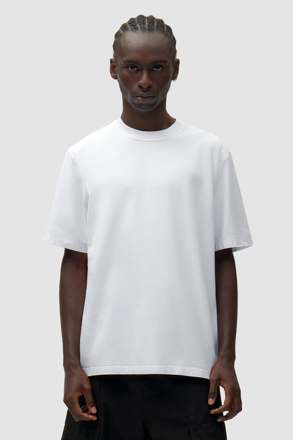 Back Collage T-shirt in White worn by a model, half-body front view