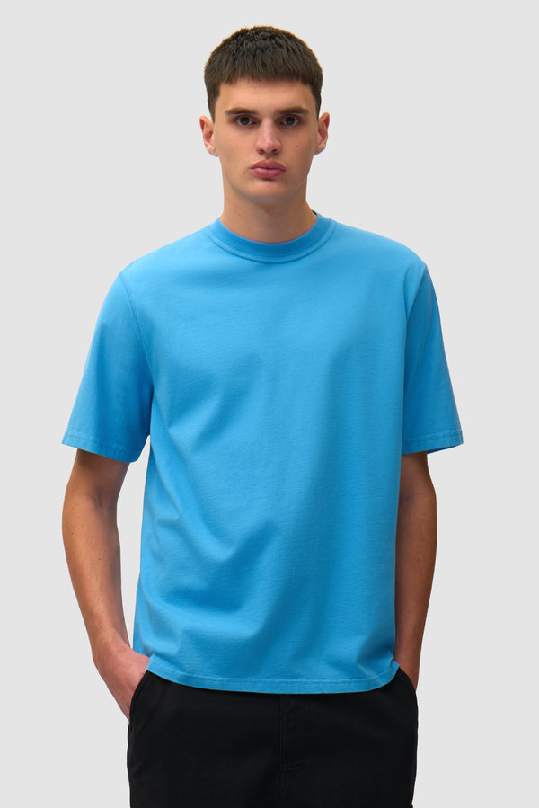 Blurry Back Print in Blue worn by a model, half-body front view