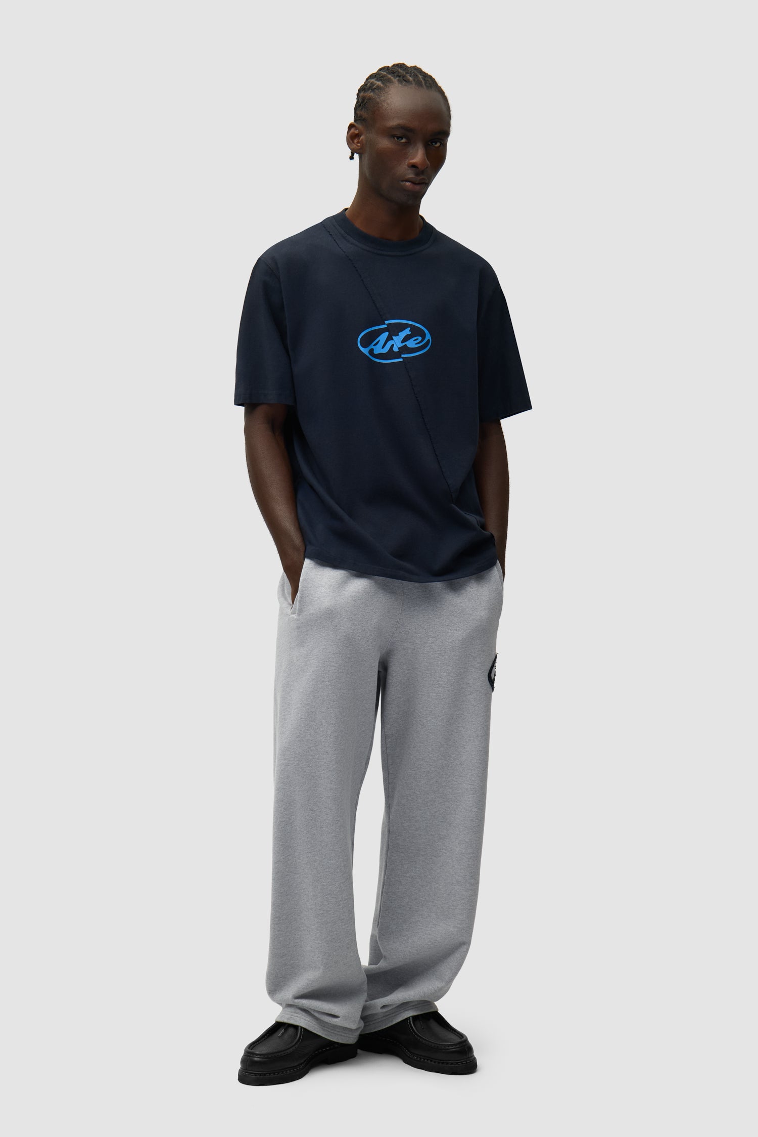 Circle Logo T-shirt in Navy worn by a model, full-body front view
