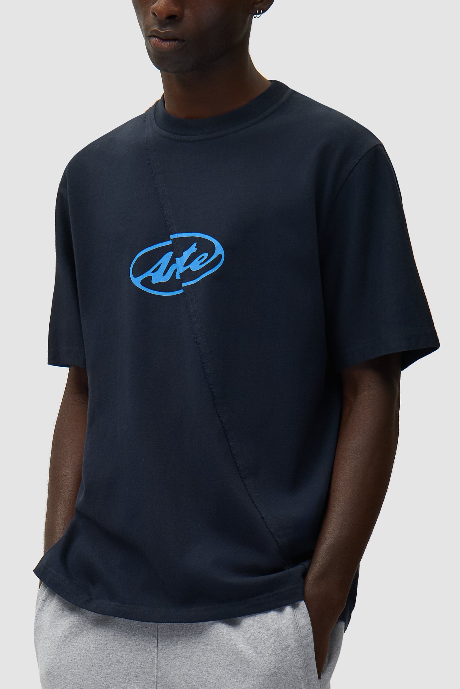 Circle Logo T-shirt in Navy worn by a model, half-body detailed view