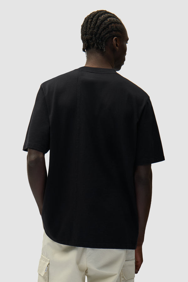Address T-shirt in Black worn by a model, half-body back view