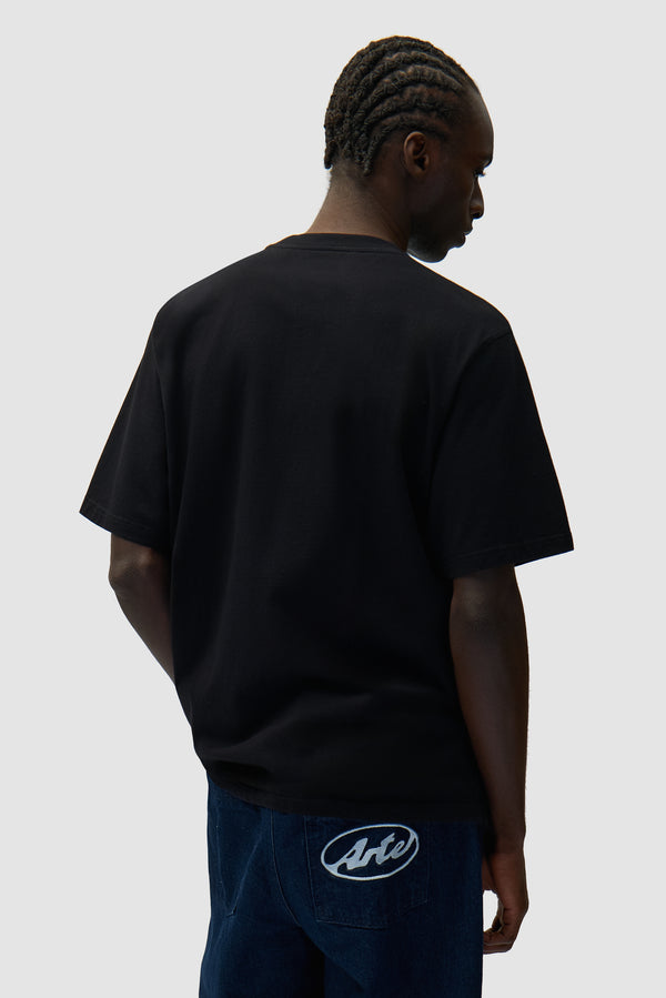 Side Logo T-shirt in Black worn by a model, half-body back view