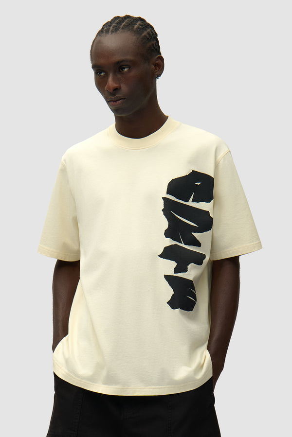 Side Logo T-shirt in Cream worn by a model, half-body front view