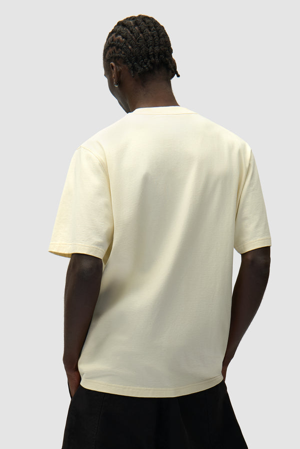 Side Logo T-shirt in Cream worn by a model, half-body back view