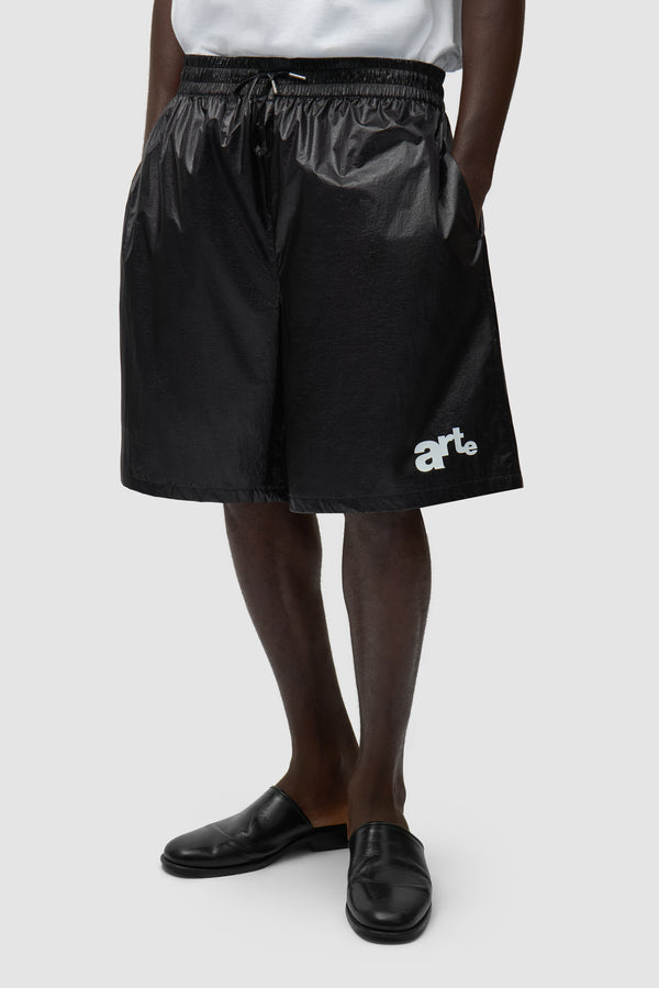 Big Logo Shorts in Black worn by a model, half-body front view