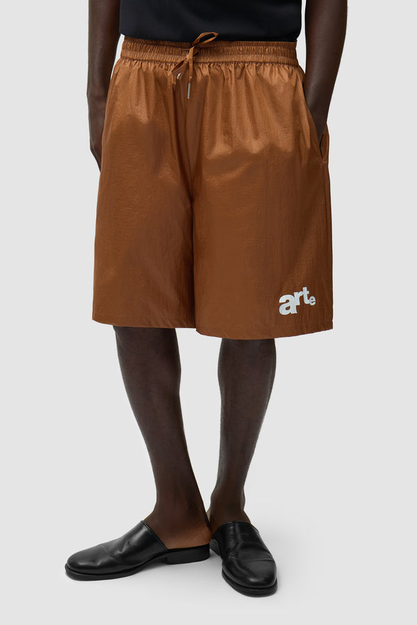 Big Logo Shorts in Orange worn by a model, half-body front view