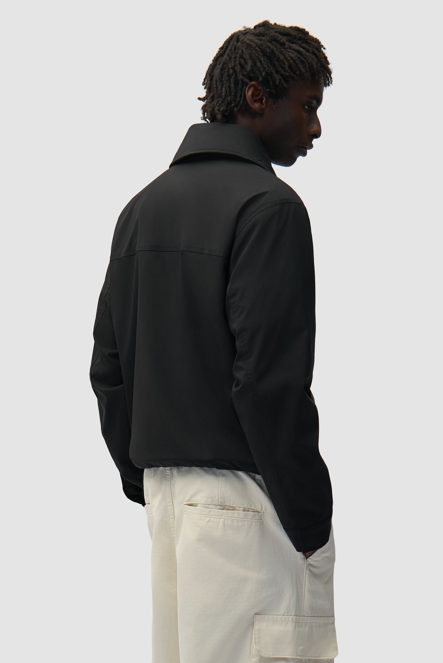 Big Collar Nylon Jacket in Black worn by a model, full-body front view