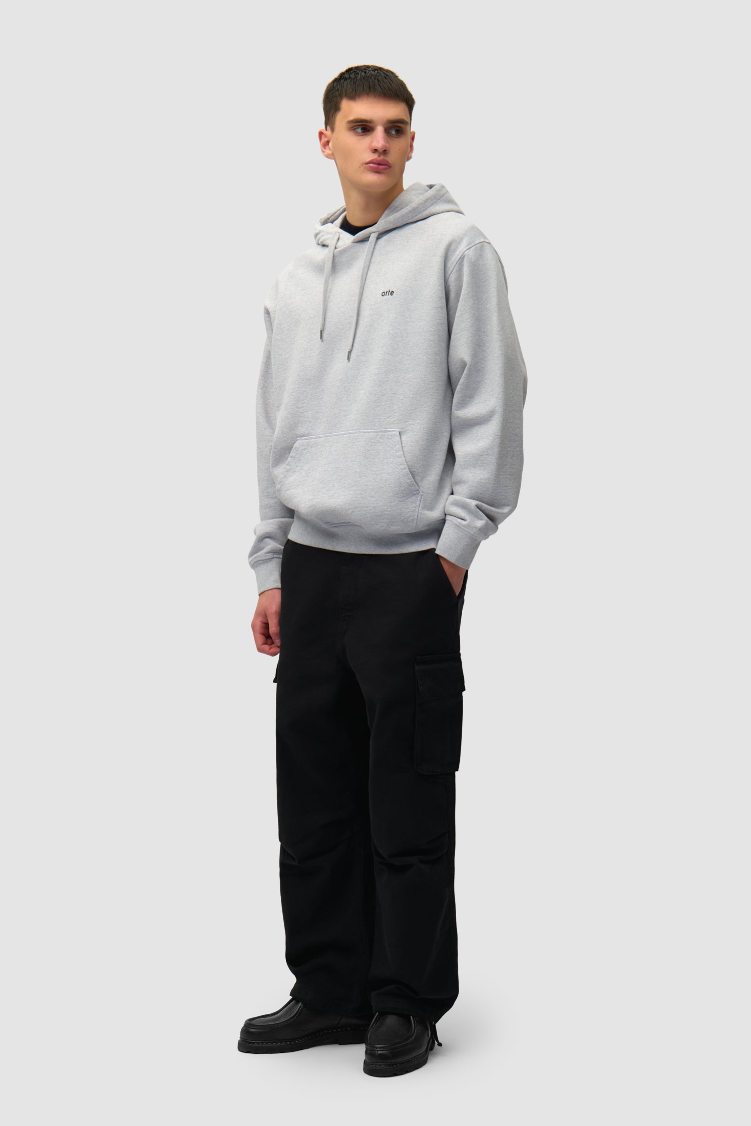 Back Poster Hoodie in Grey worn by a model, full-body front view