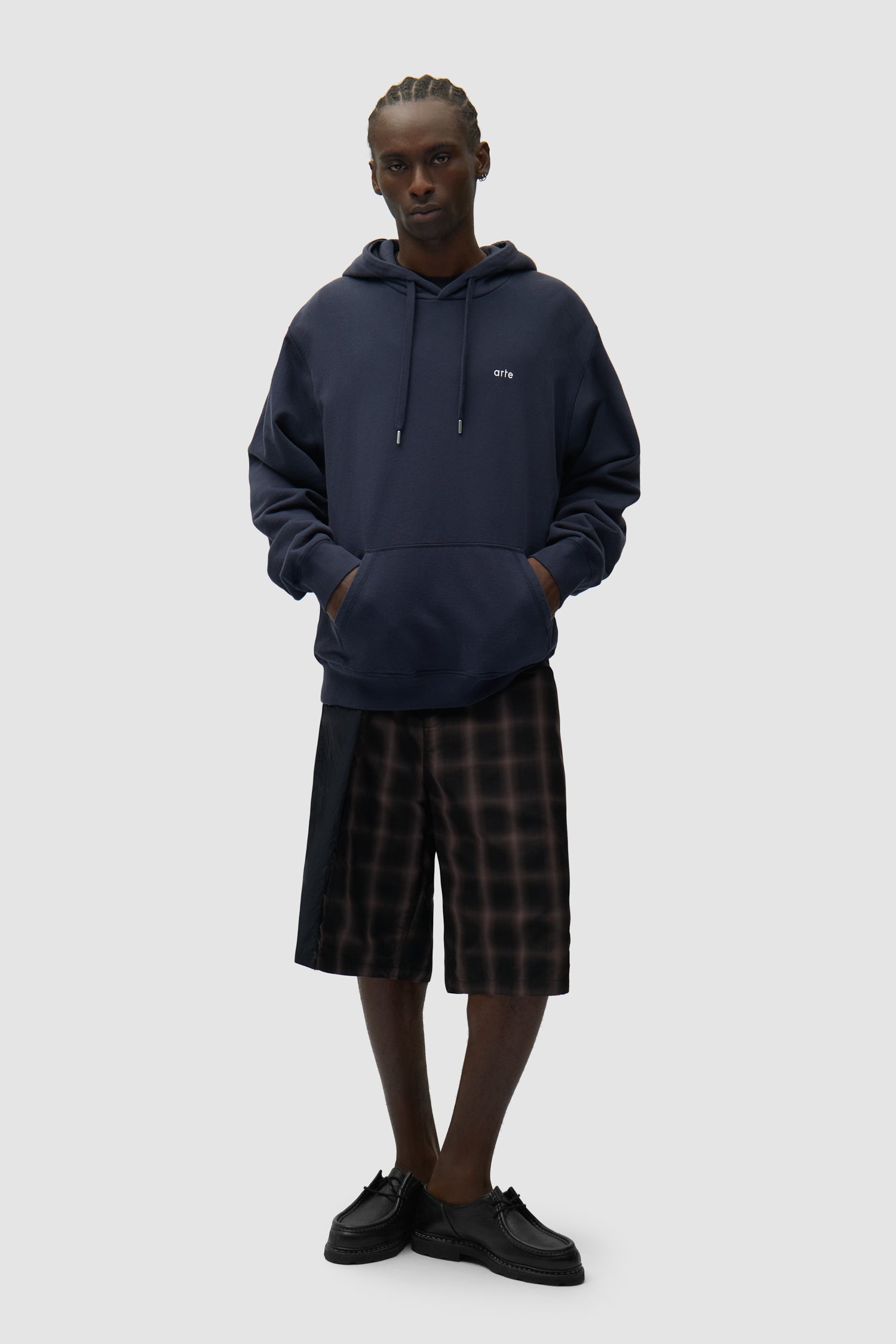 Back Poster Hoodie in Navy worn by a model, full-body front view