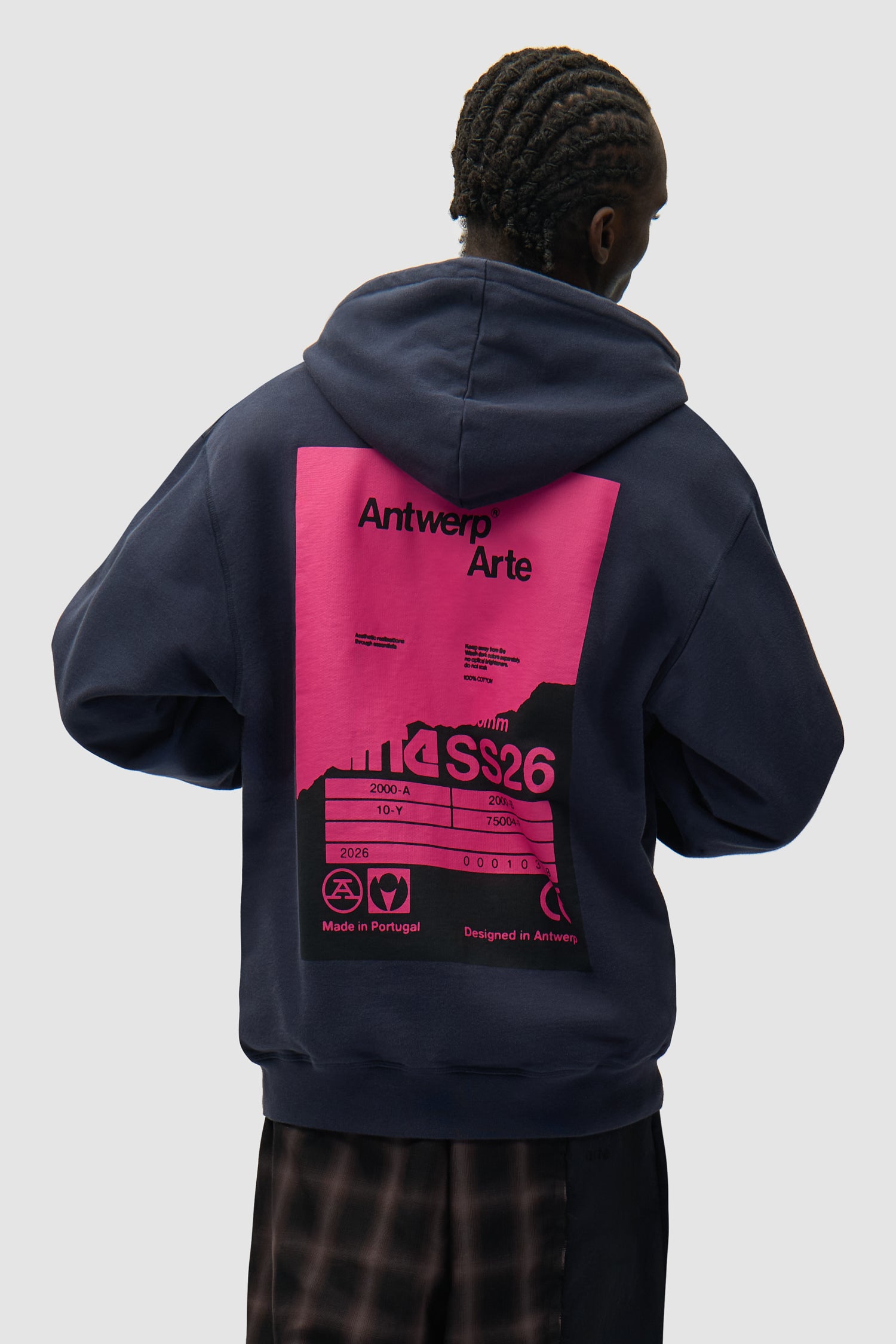 Back Poster Hoodie in Navy worn by a model, half-body back view