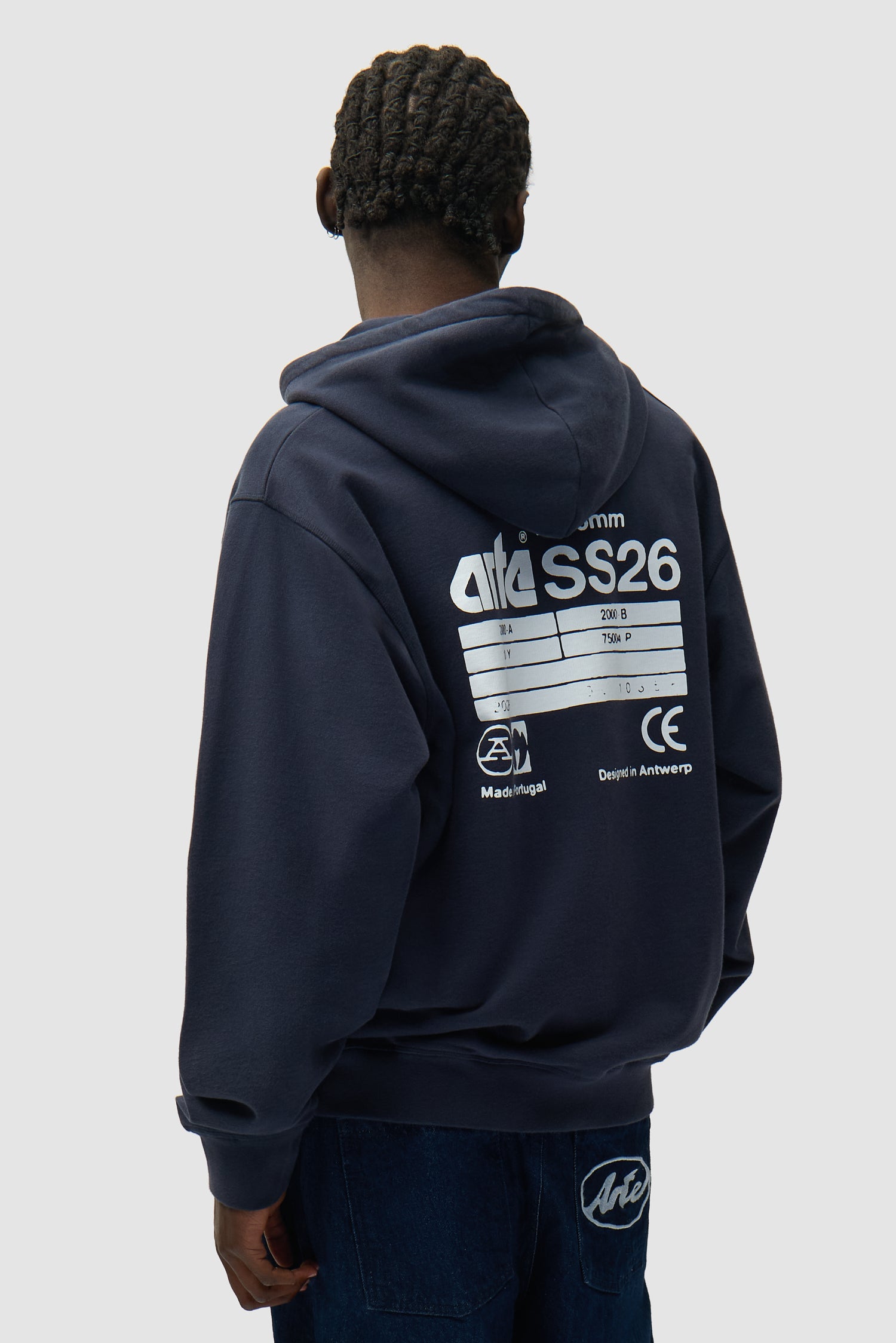 Back SS26 Hoodie in Navy worn by a model, half-body back view