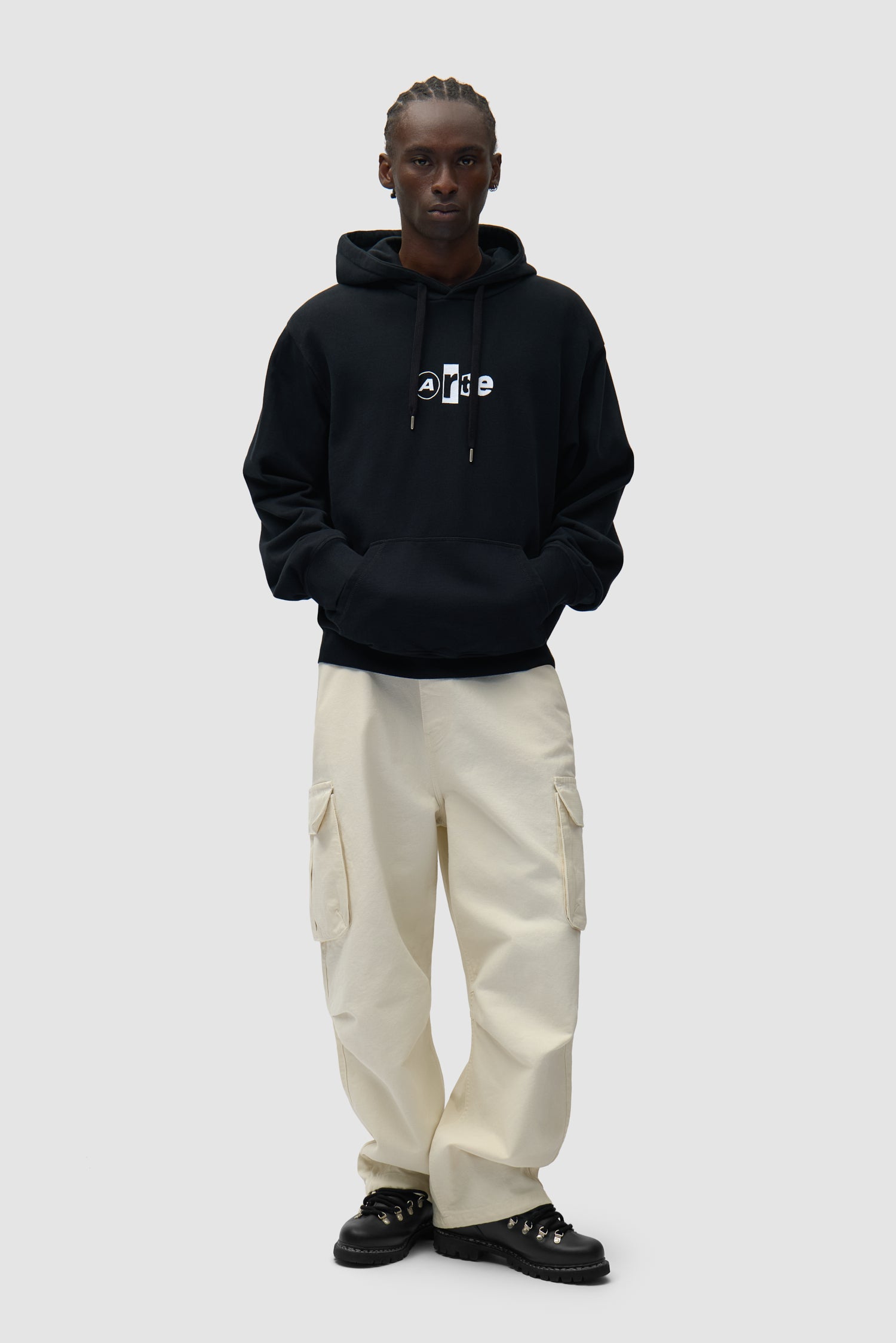 Collage Logo Hoodie in Black worn by a model, full-body front view