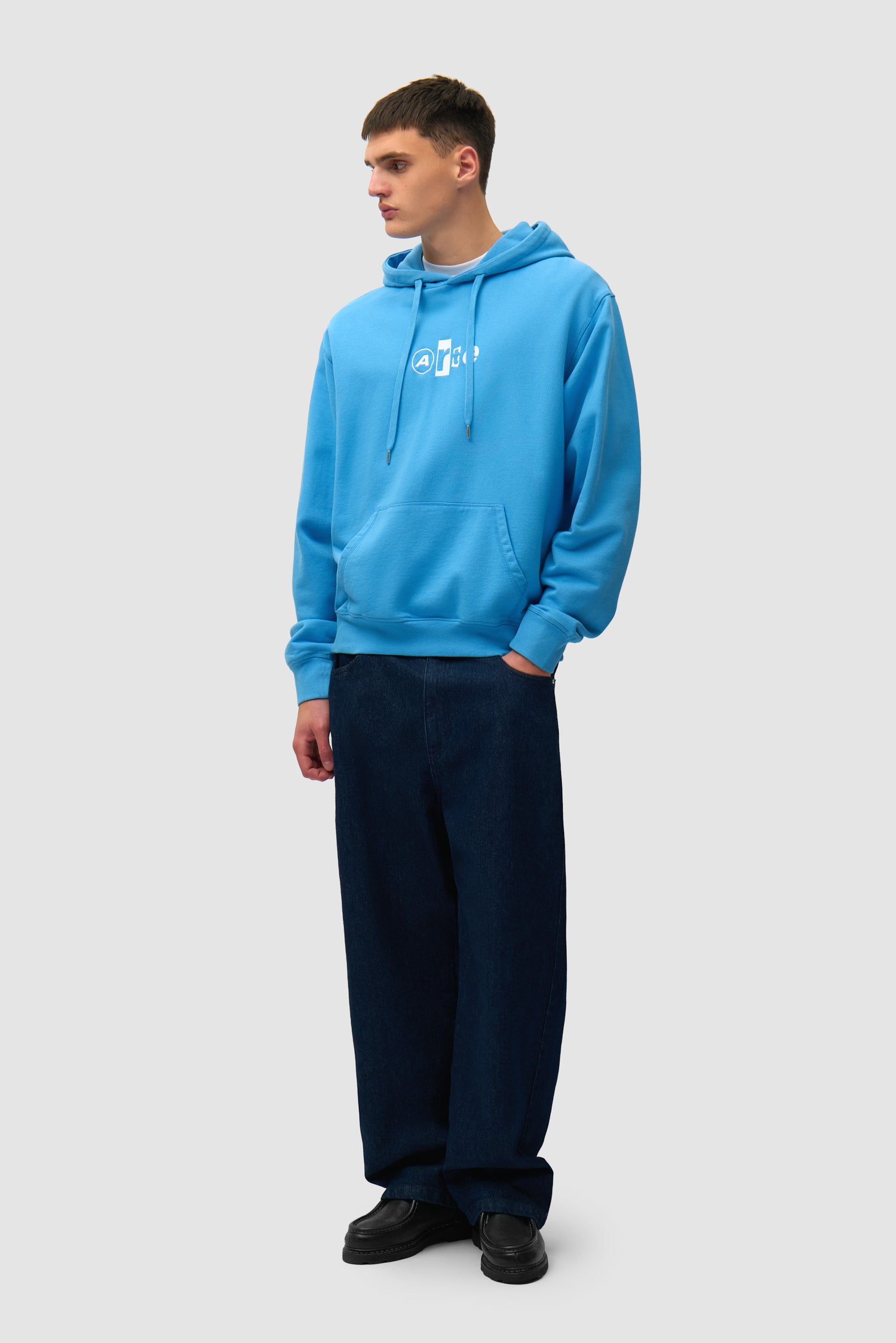 Collage Logo Hoodie in Blue worn by a model, full-body front view