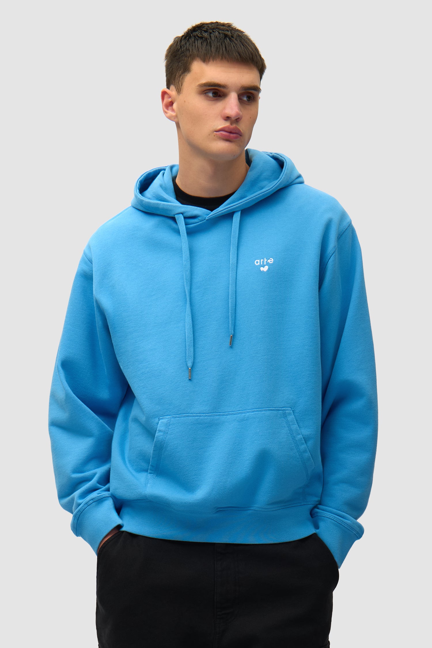 Heart Logo Hoodie in Blue worn by a model, half-body front view