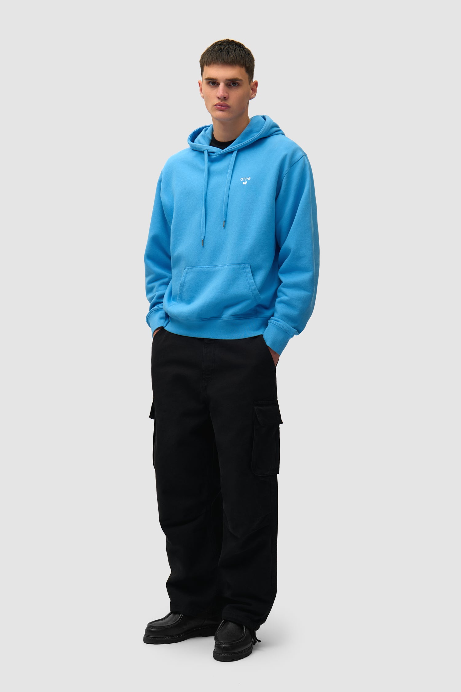 Heart Logo Hoodie in Blue worn by a model, full-body front view