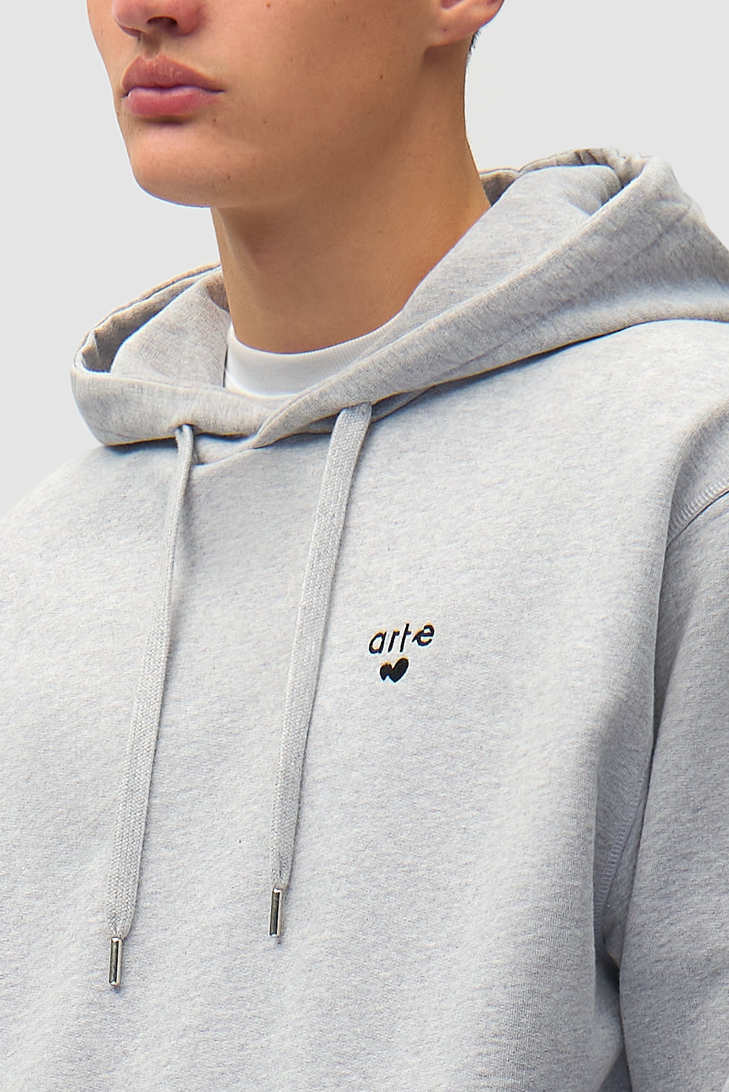 Detail view of Heart Logo Hoodie in Grey, showing logo