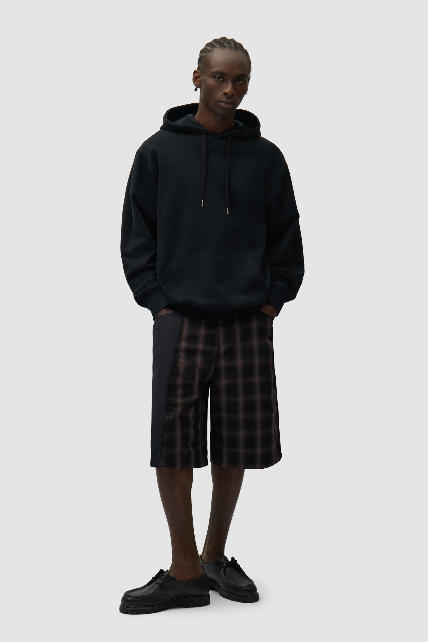 Back Abstract Hoodie in Black worn by a model, full-body back view