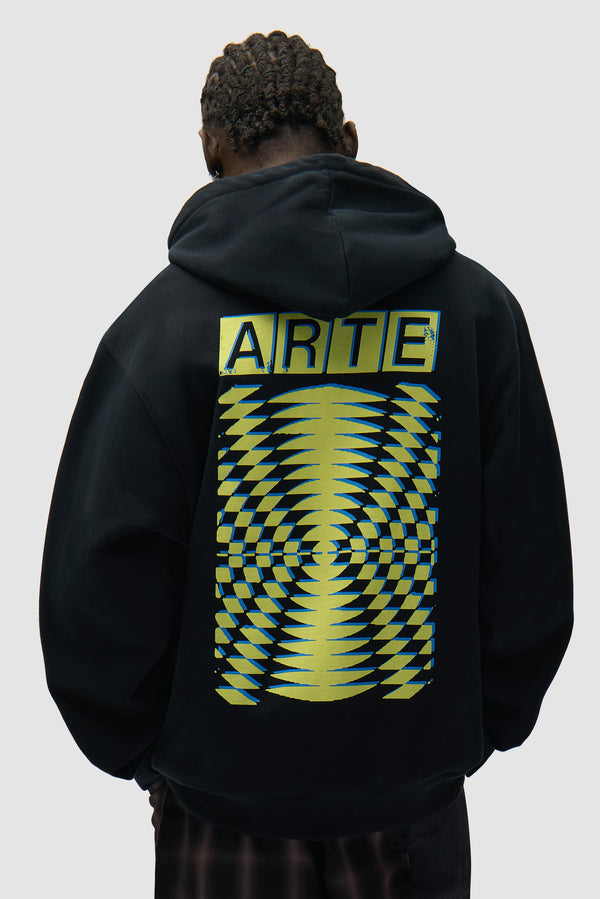 Back Abstract Hoodie in Black worn by a model, half-body back view