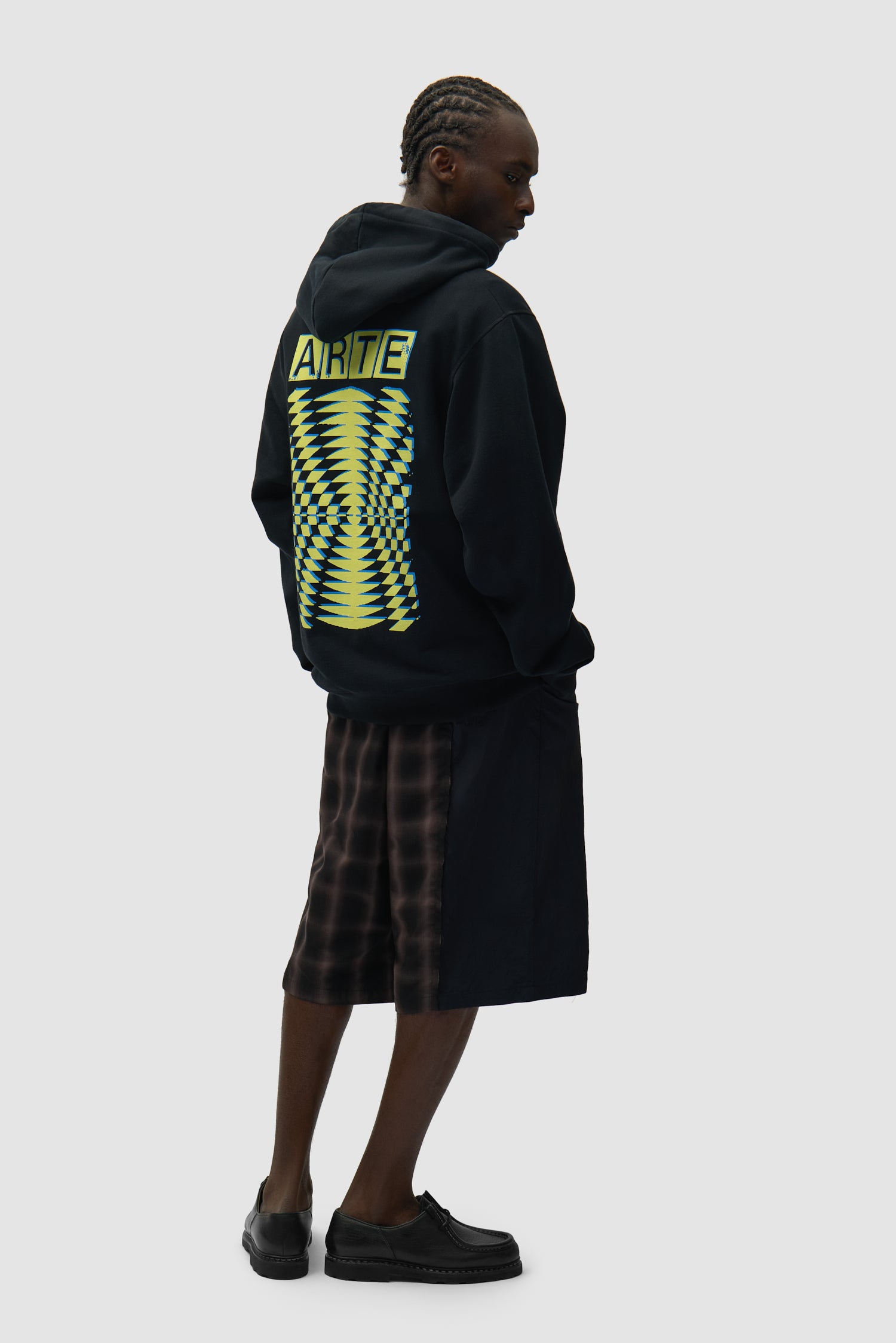 Back Abstract Hoodie in Black worn by a model, full-body front view