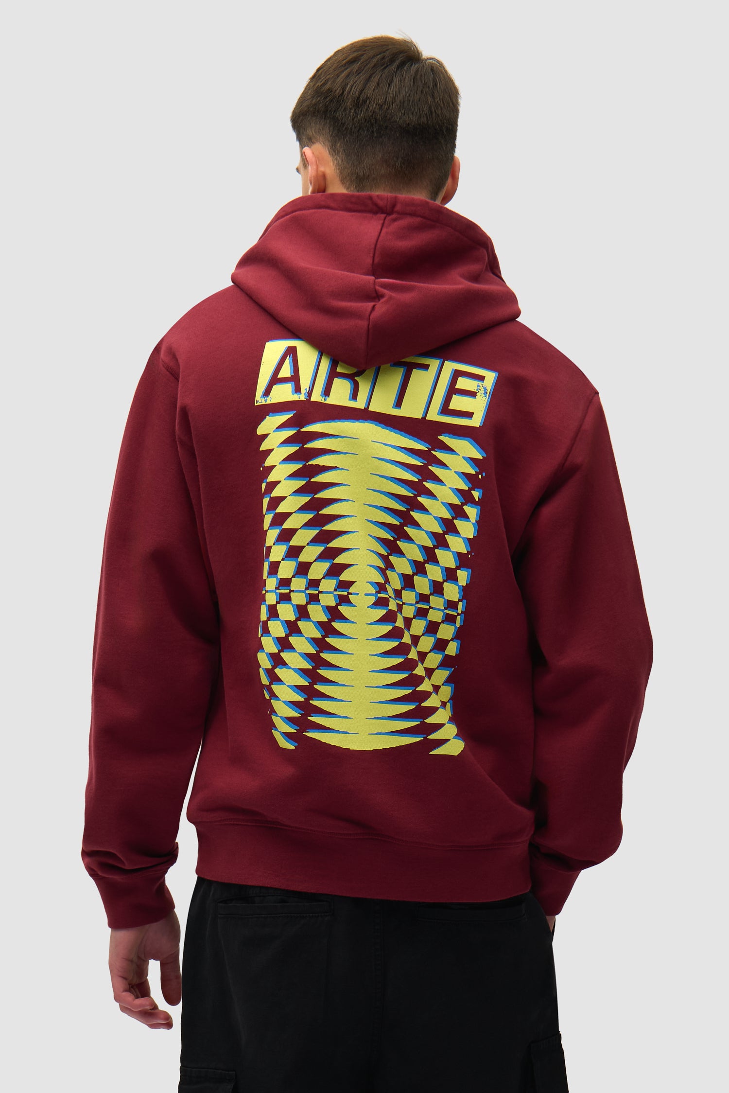 Back Abstract Hoodie in Bordeaux worn by a model, half-body back view