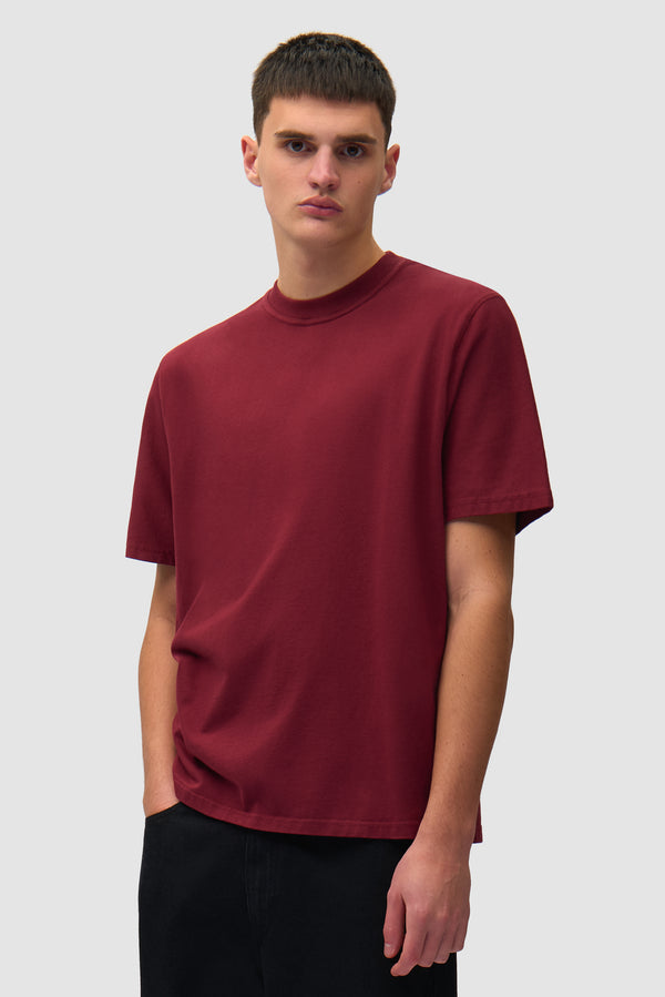 Faded Back Print T-shirt in Bordeaux worn by a model, half-body front view
