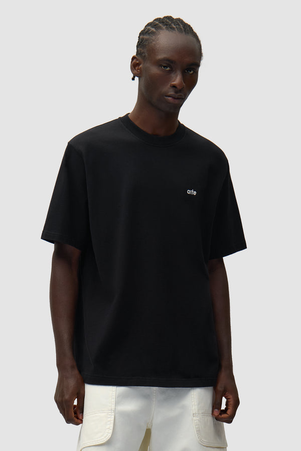 Back Graphic T-shirt in Black worn by a model, half-body front view