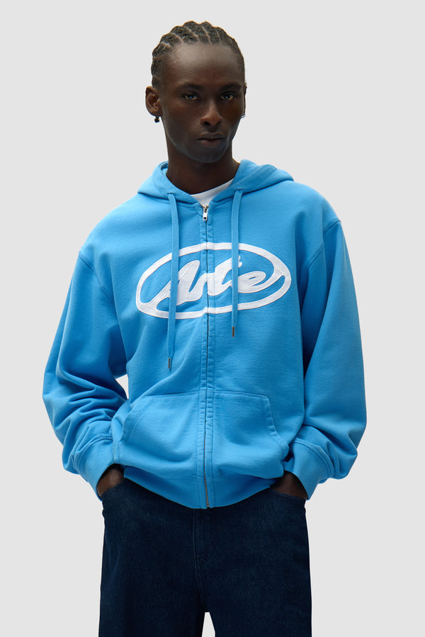 Circle Logo Zip Hoodie in Blue worn by a model, half-body front view