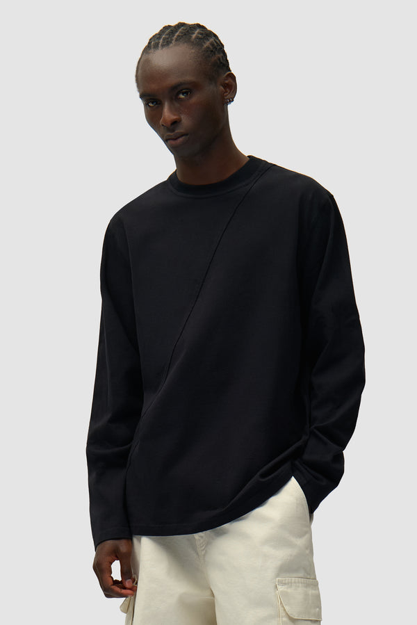 Back Circle Logo Longsleeve in Black worn by a model, half-body front view