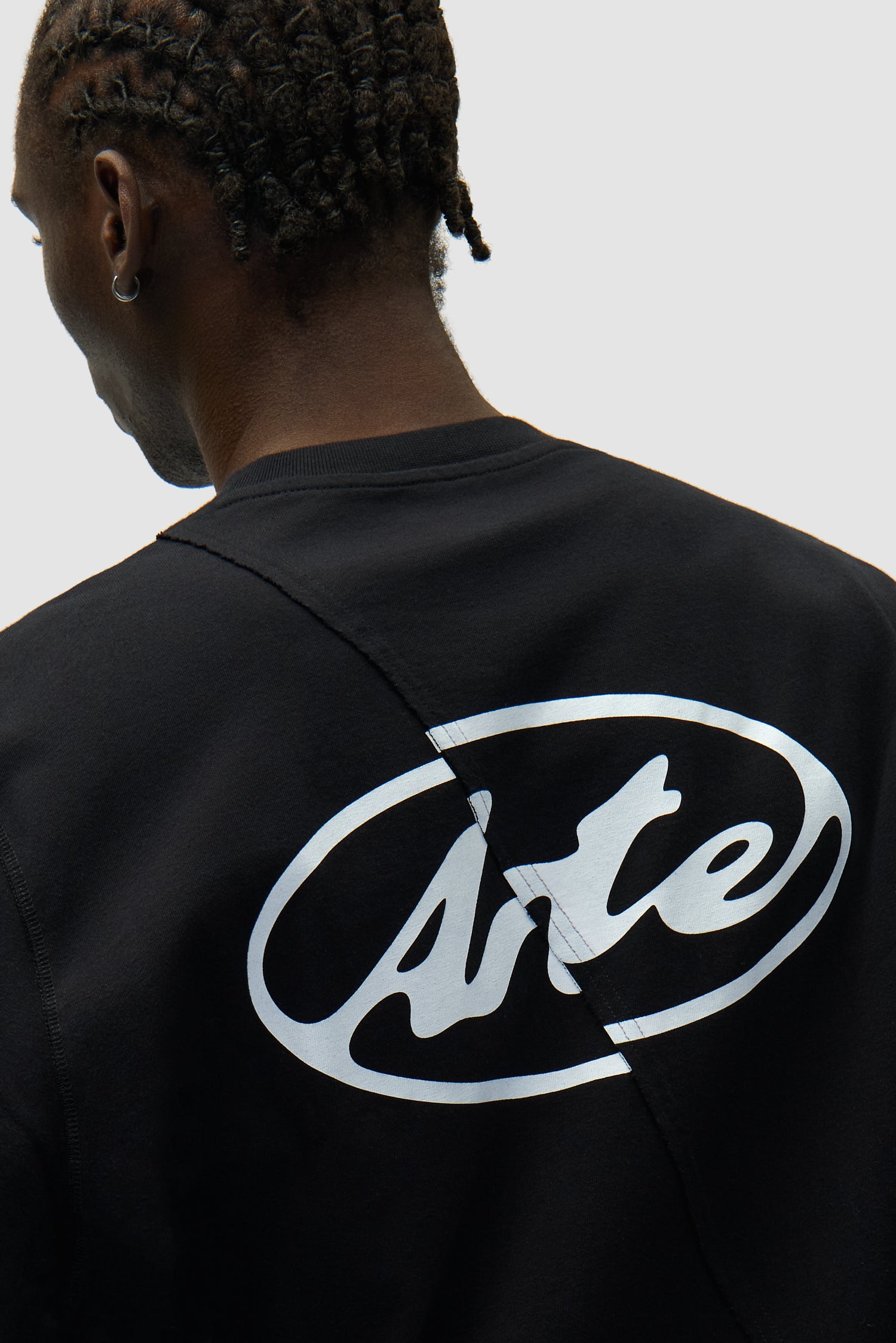 Detail view of Back Circle Logo Longsleeve in Black, showing back logo