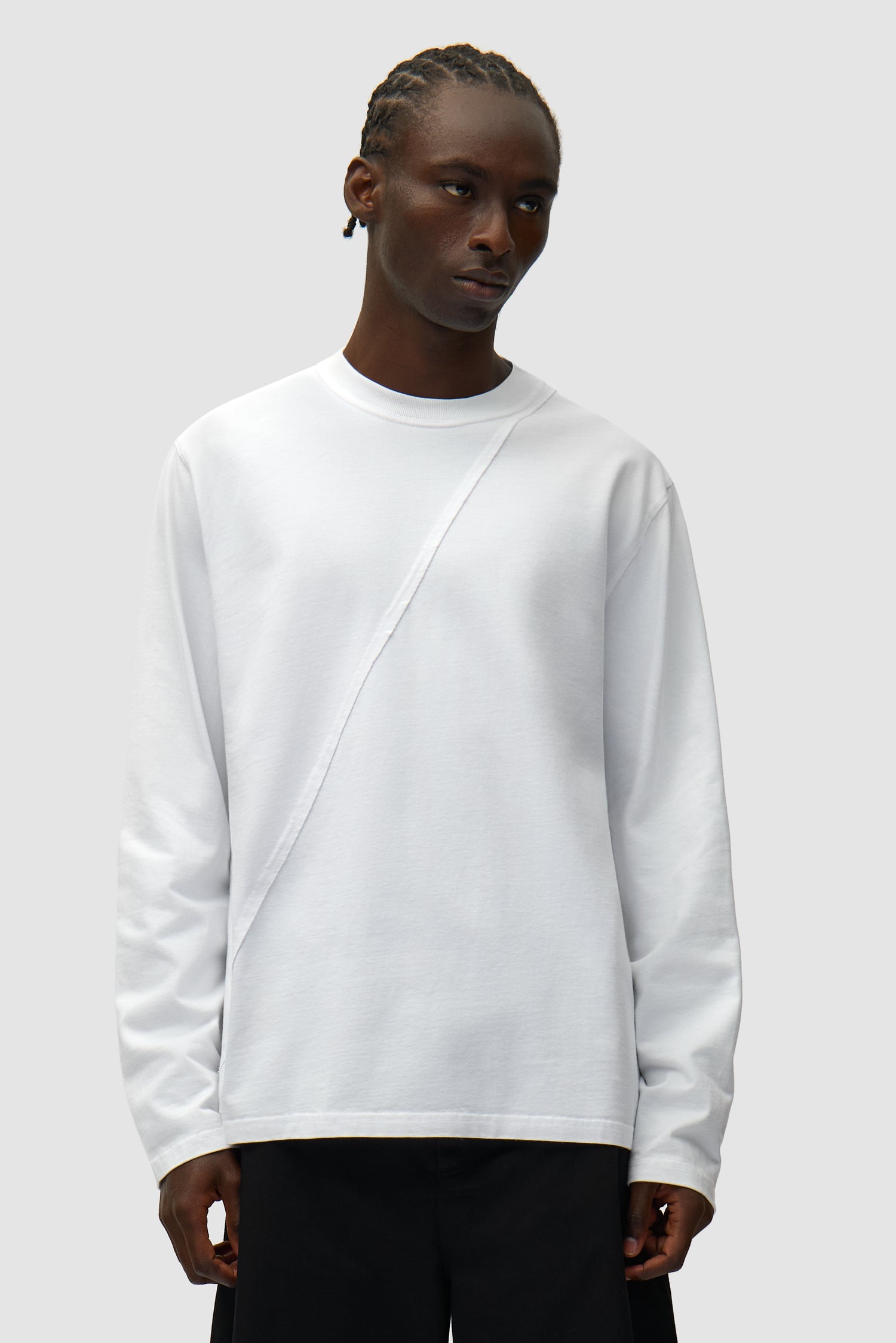 Back Circle Logo Longsleeve in White worn by a model, half-body front view