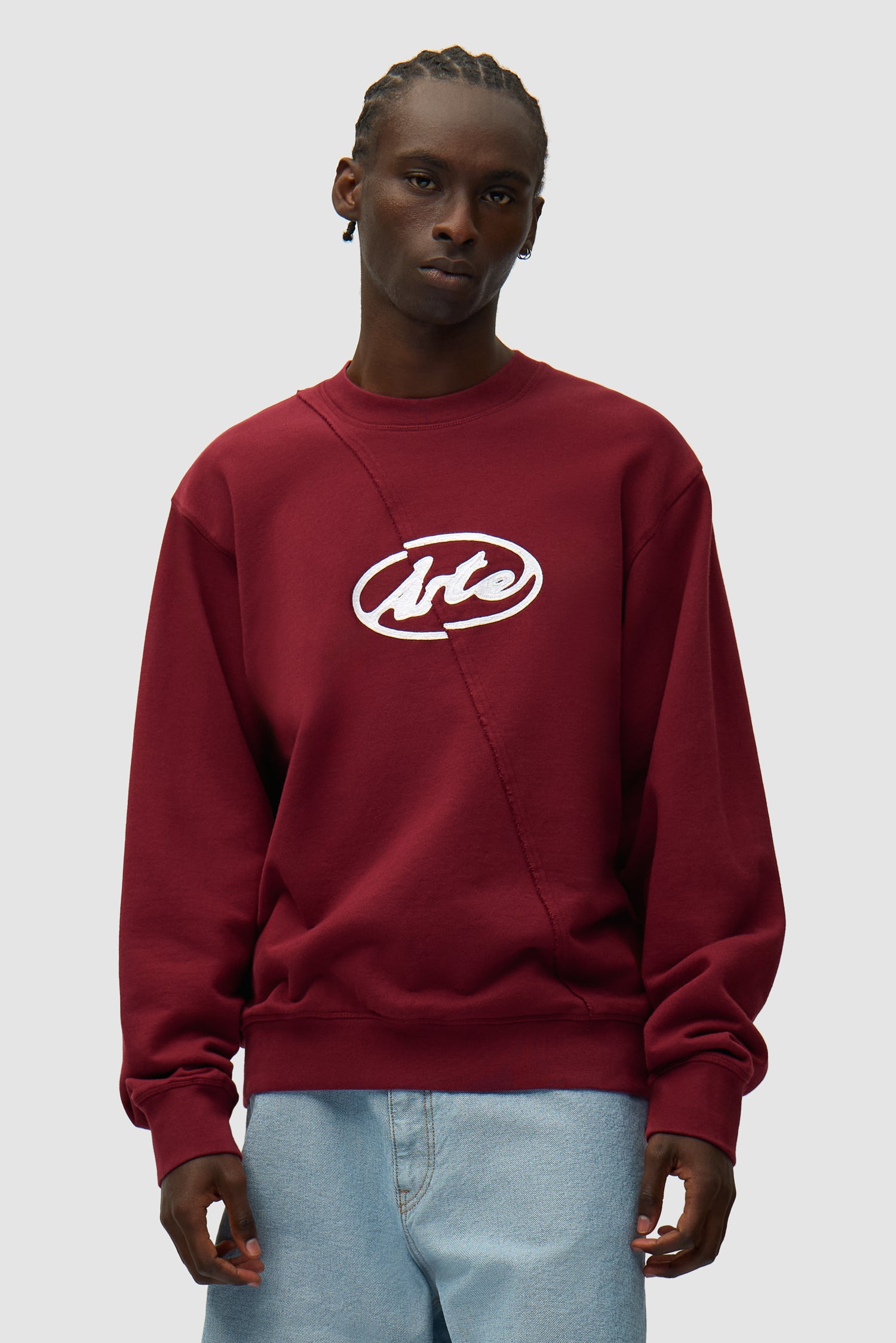 Circle Logo Embroidery Sweater in Bordeaux worn by a model, half-body front view
