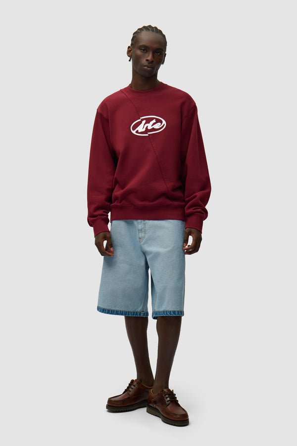 Circle Logo Embroidery Sweater in Bordeaux worn by a model, half-body back view