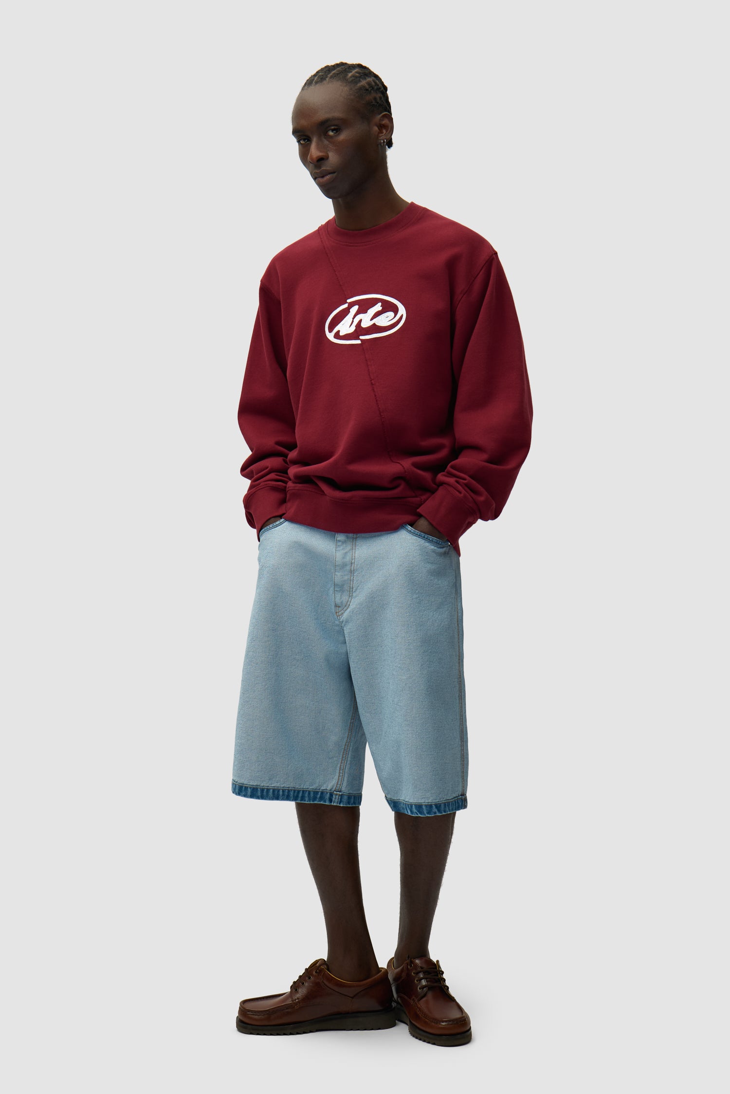 Circle Logo Embroidery Sweater in Bordeaux worn by a model, full-body back view