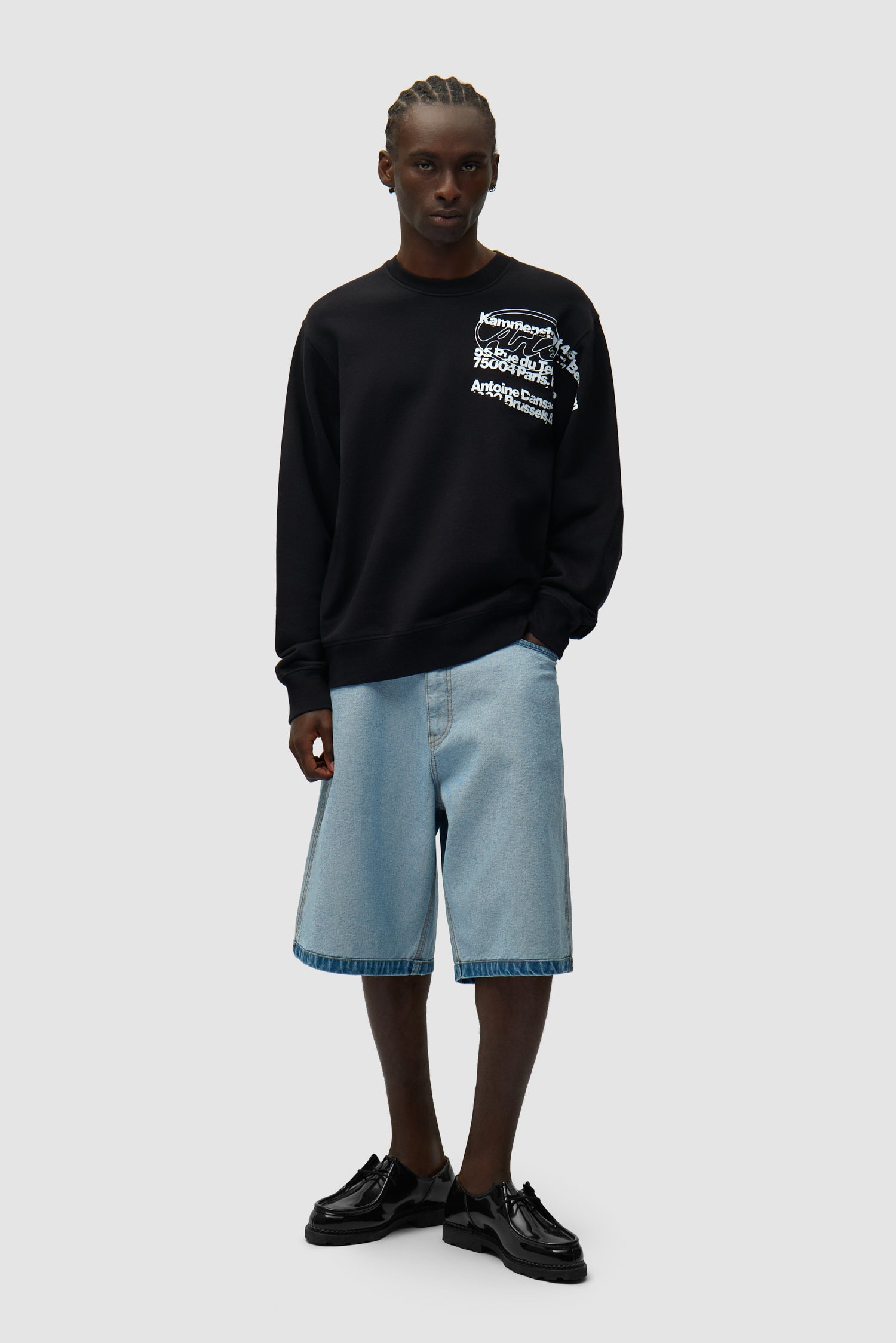 Address Crewneck in Black worn by a model, full-body side view