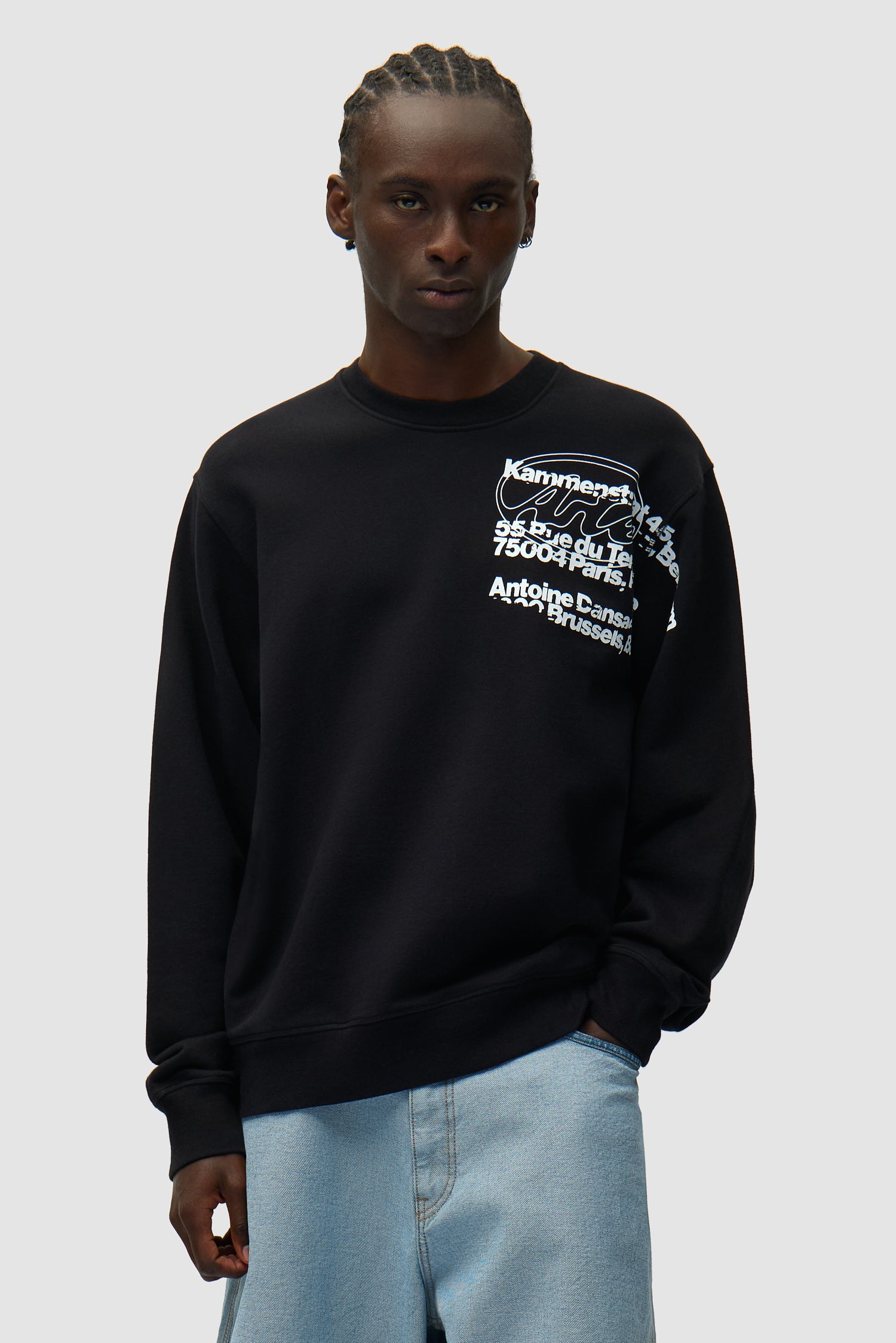 Address Crewneck in Black worn by a model, half-body front view