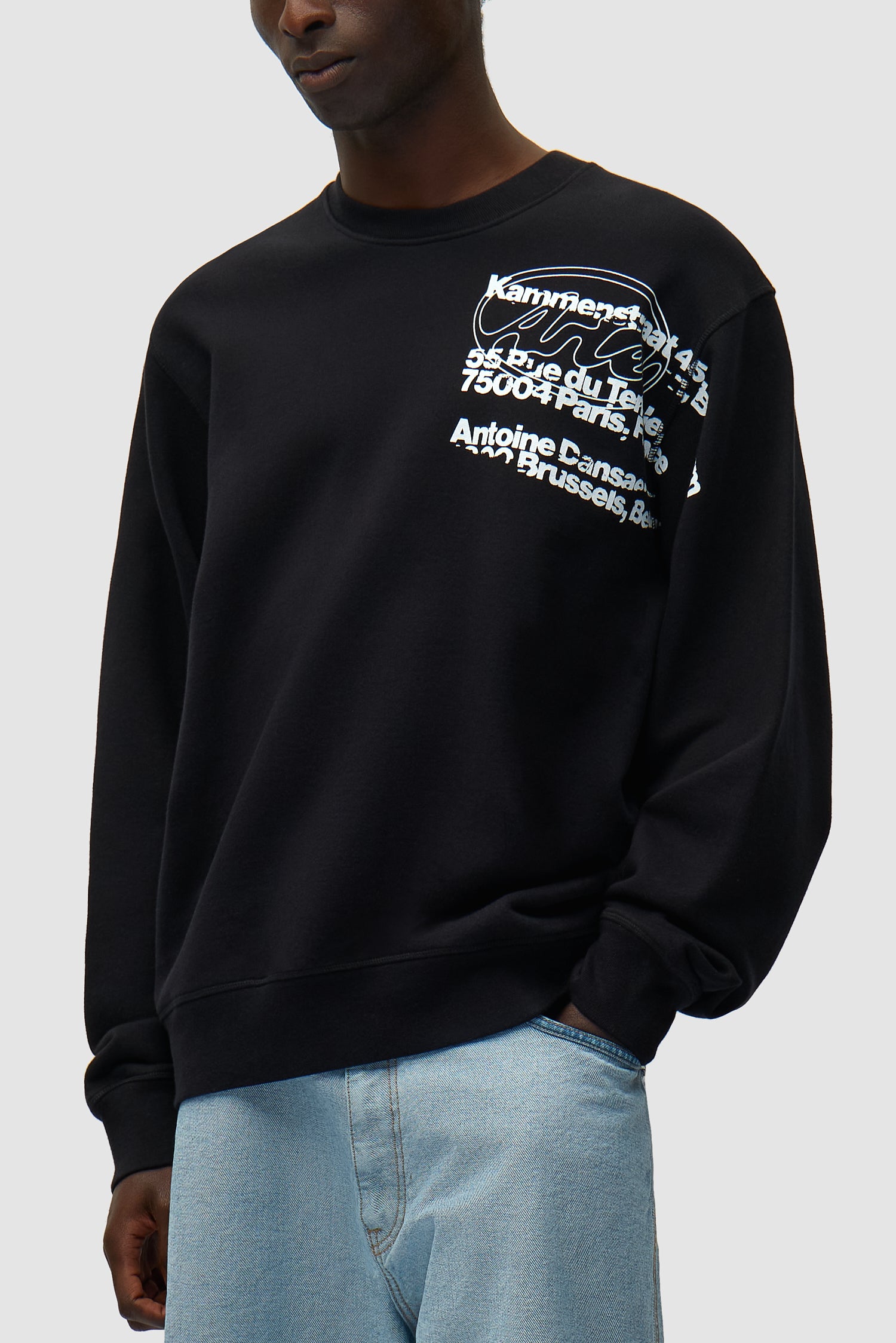 Address Crewneck in Black worn by a model, half-body detailed view