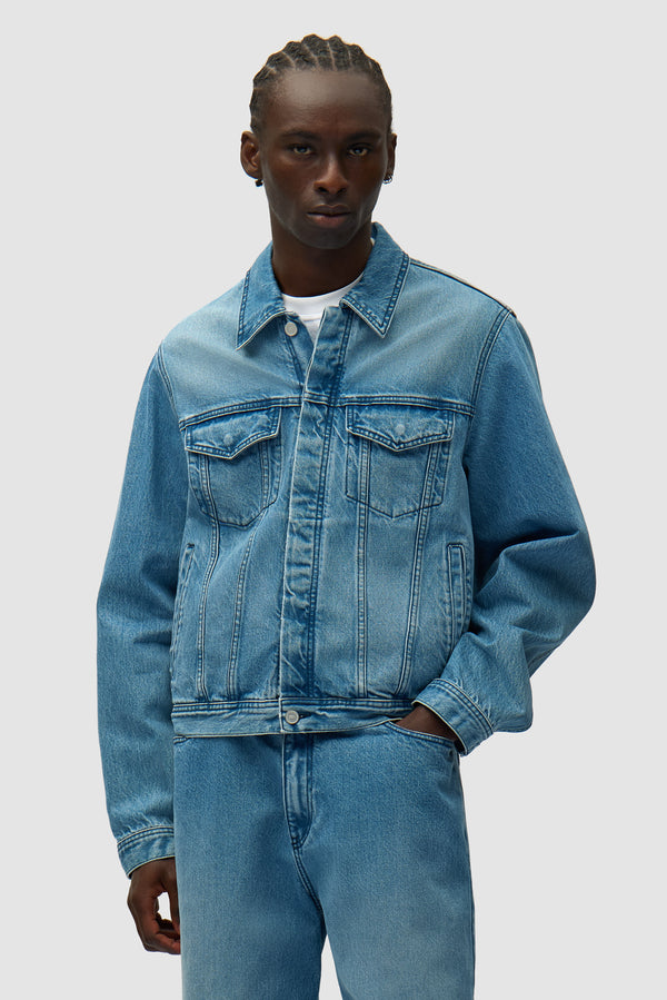 Circle Logo Jeans Jacket in Denim Bleach worn by a model, half-body front view