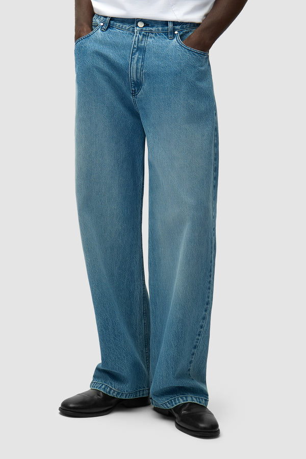 Circle Logo Pocket Pants in Denim Bleach worn by a model, half-body front view