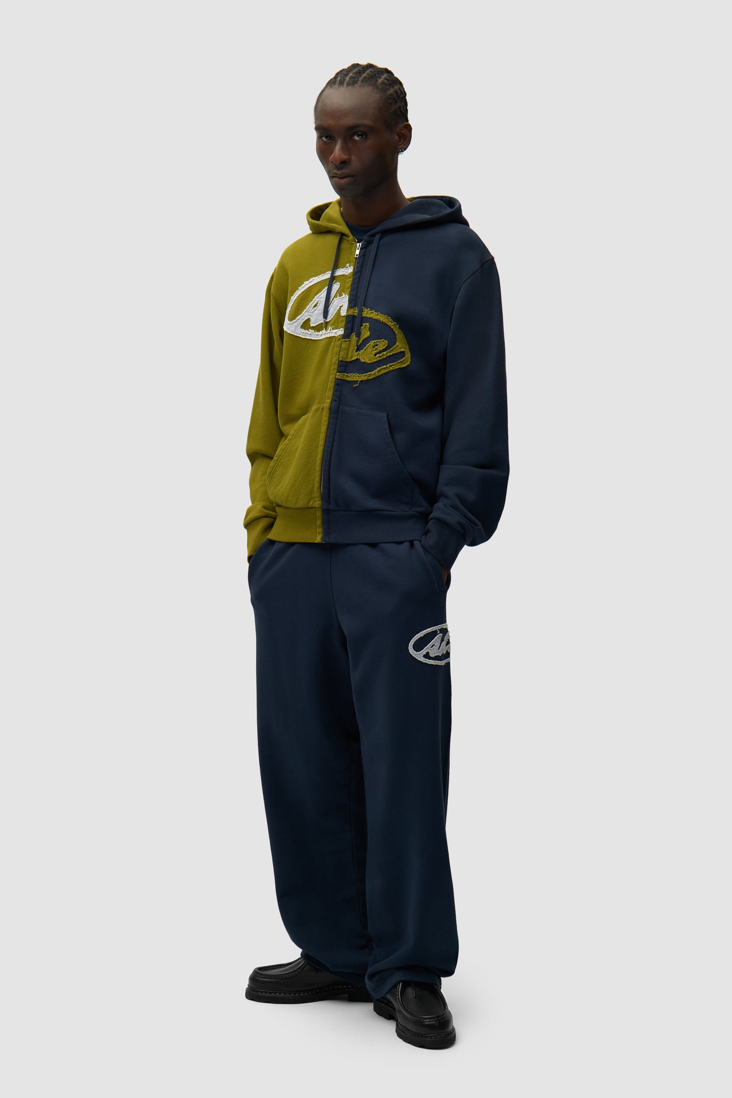 Split Patch Zip Hoodie in Green/Navy worn by a model, full-body front view