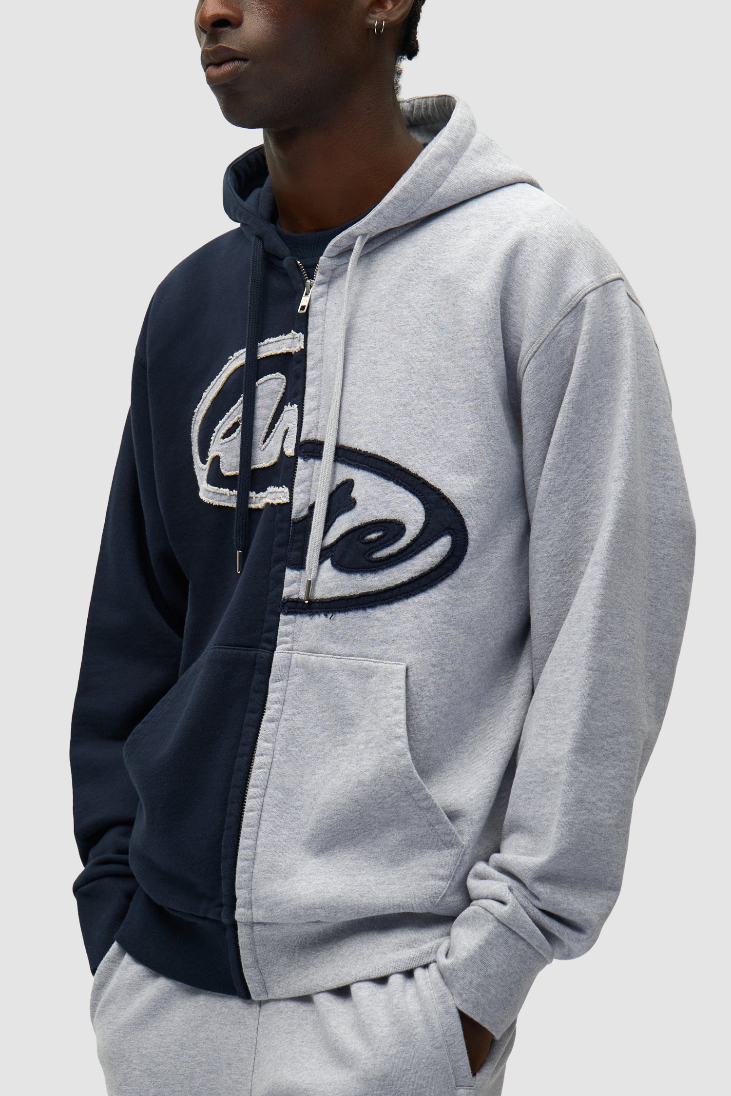 Split Patch Zip Hoodie in Grey/Navy worn by a model, half-body detailed view