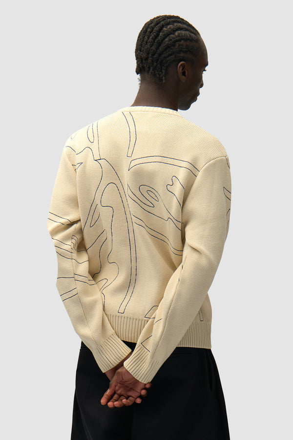 Allover Circle Logo Knit in Cream worn by a model, half-body back view