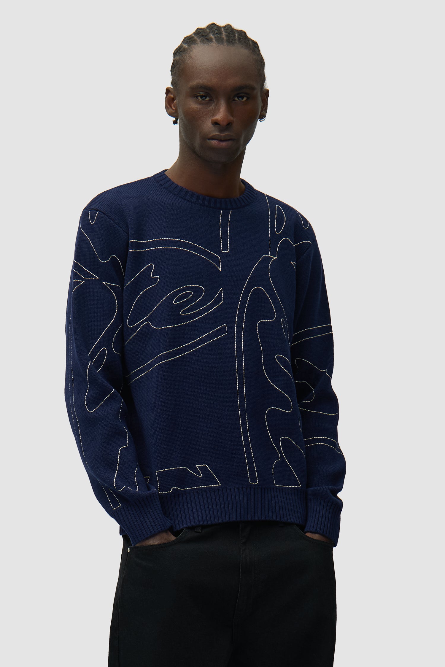 Allover Circle Logo Knit in Navy worn by a model, half-body front view