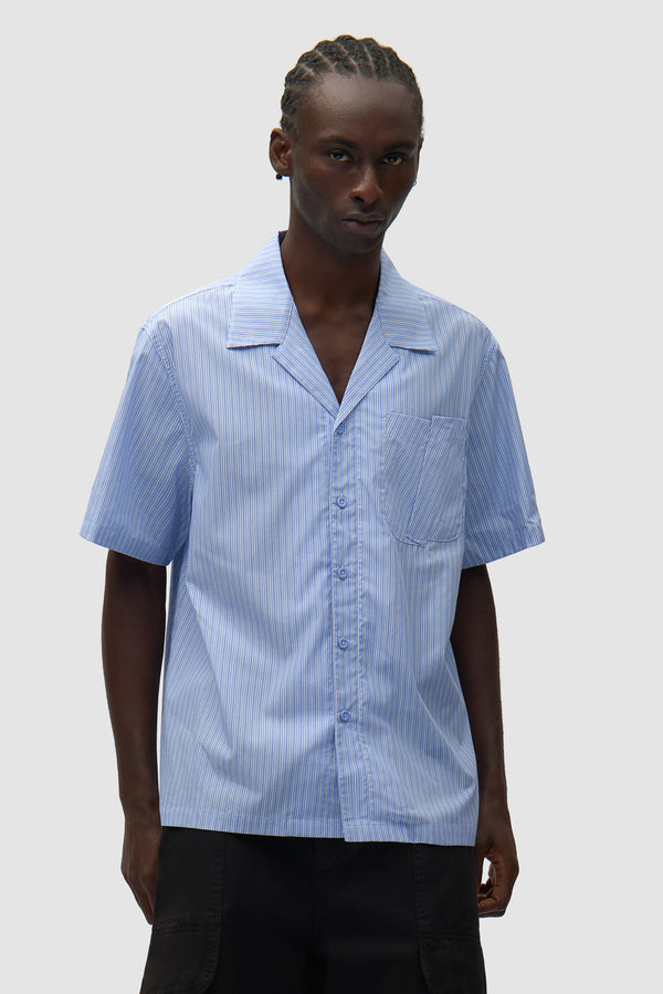 Fold Pocket Shirt in Striped worn by a model, half-body front view
