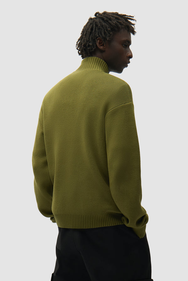 Diels Collar Cardigan in Green worn by a model, half-body back view