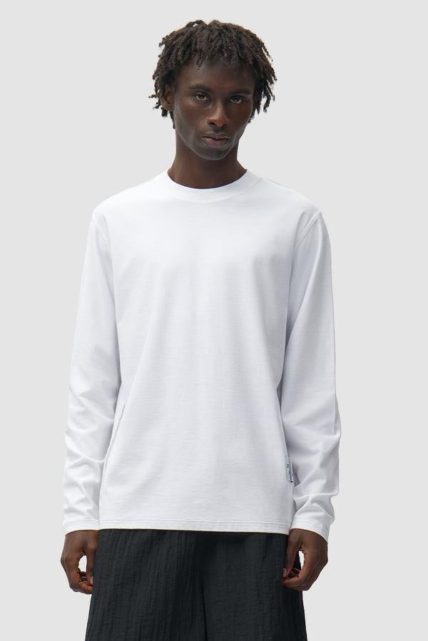 Reversible label Longsleeve in White worn by a model, half-body front view