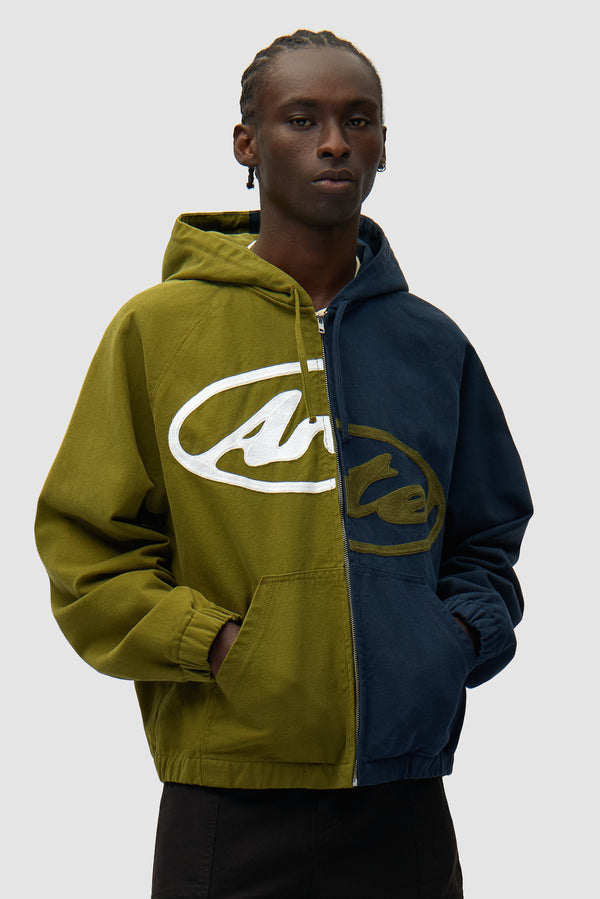 Split Logo canvas Hood Jacket in Navy/Green worn by a model, half-body front view