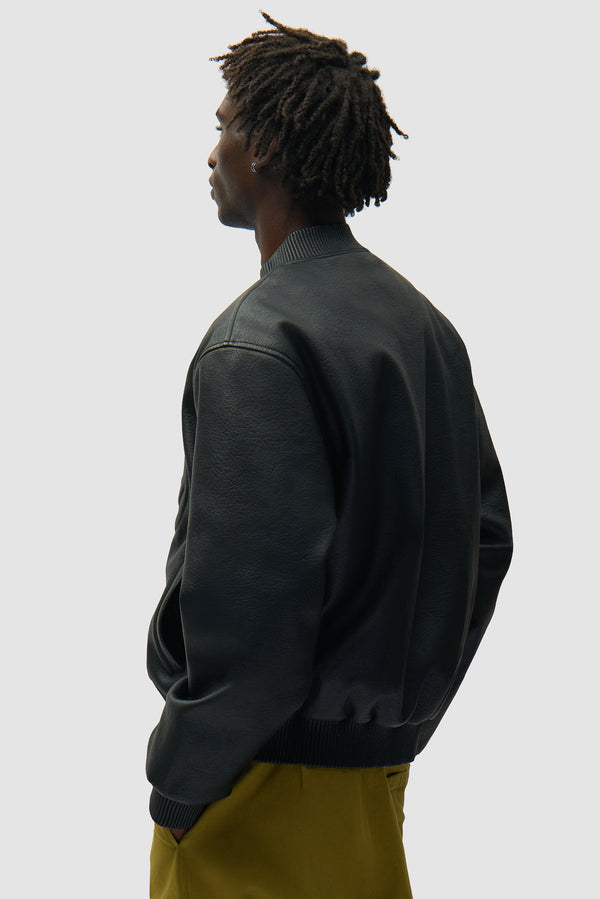 Half Logo Leather Jacket in Black worn by a model, half-body back view