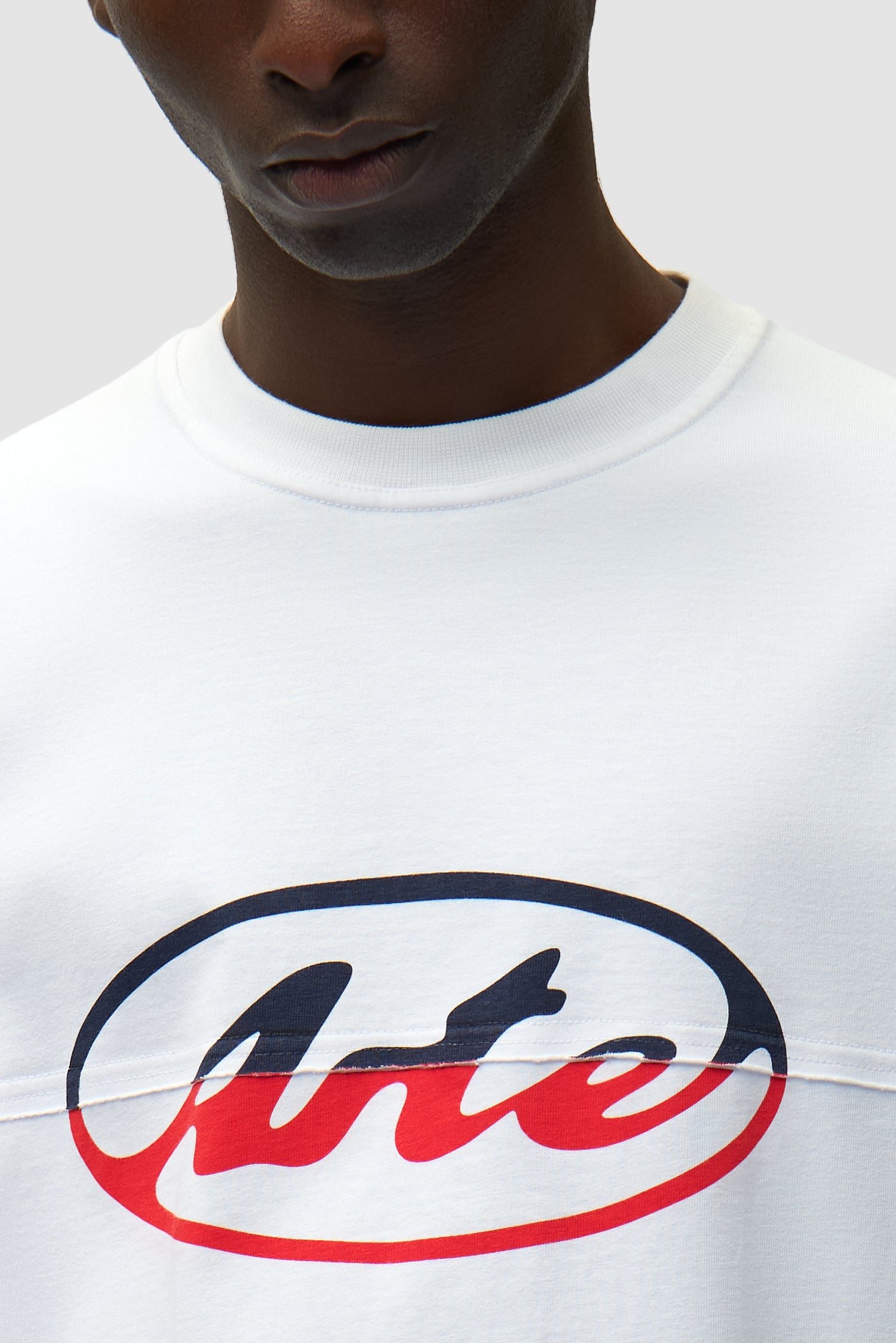 Detail view of Circle Logo Cut T-shirt in White, showing front view