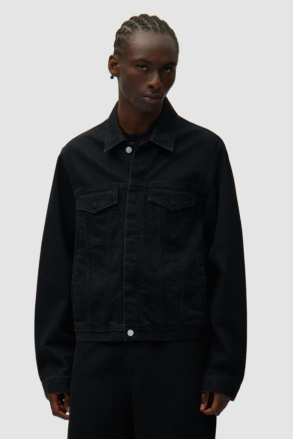 Circle Logo Jeans Jacket in Black worn by a model, half-body front view
